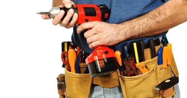Handyman Holding An Electric Drill With A Tool Belt On - Find Handyman Services Near Me - HandymanFinder.net - Handyman Business Directory